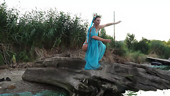 Coed Girl Dances On The Beach At Sunset